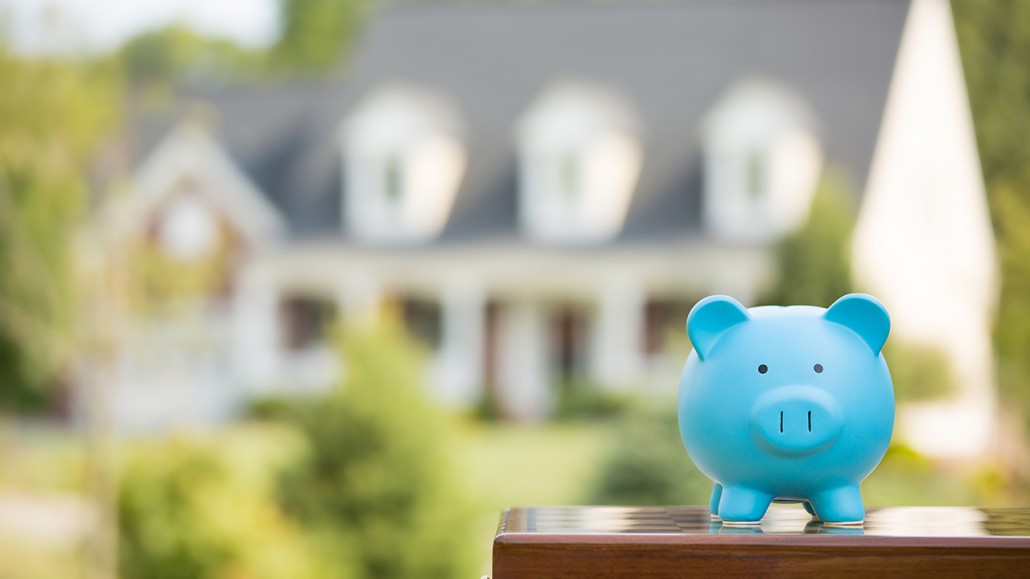 piggy bank in front of house
