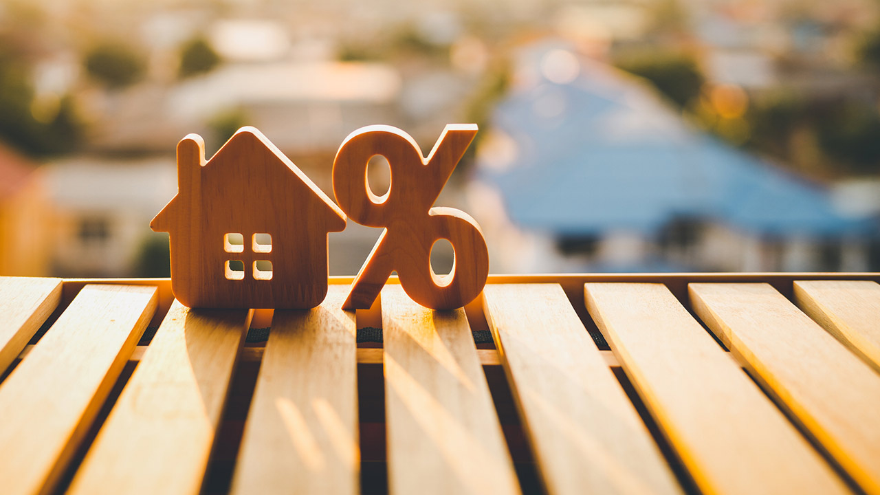 Percentage and house sign symbol icon wooden on wood table